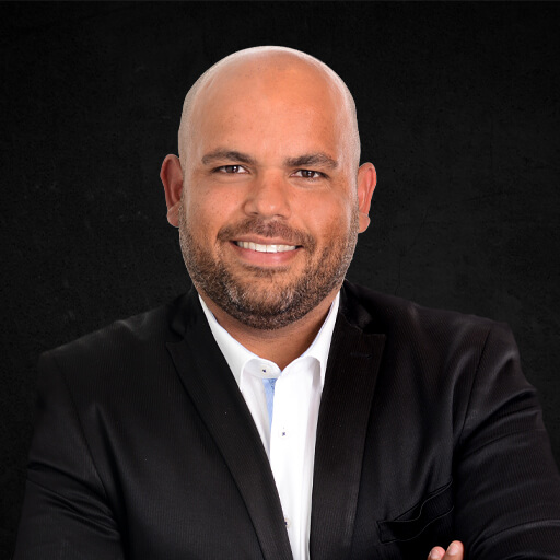 GBE brokers branch manager Nasar Ghulam on dark background